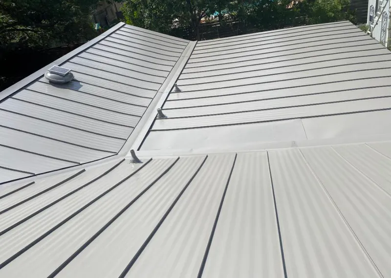 Solar attic fan installed on a metal roof for Roof Ventilation in East Rutherford